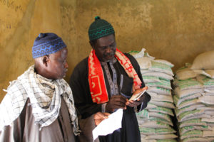 Farmers have made the trek to the Tool Baye Seed Cooperative processing unit.